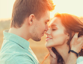 couple on beach about to kiss