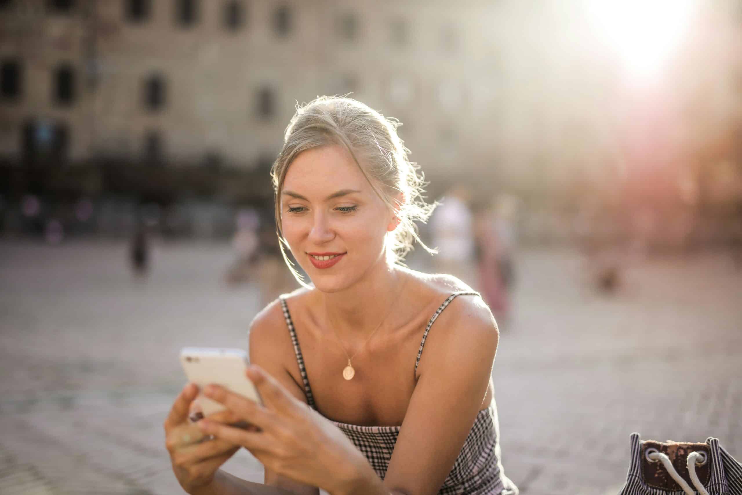 young woman using the best dating app for iPhone