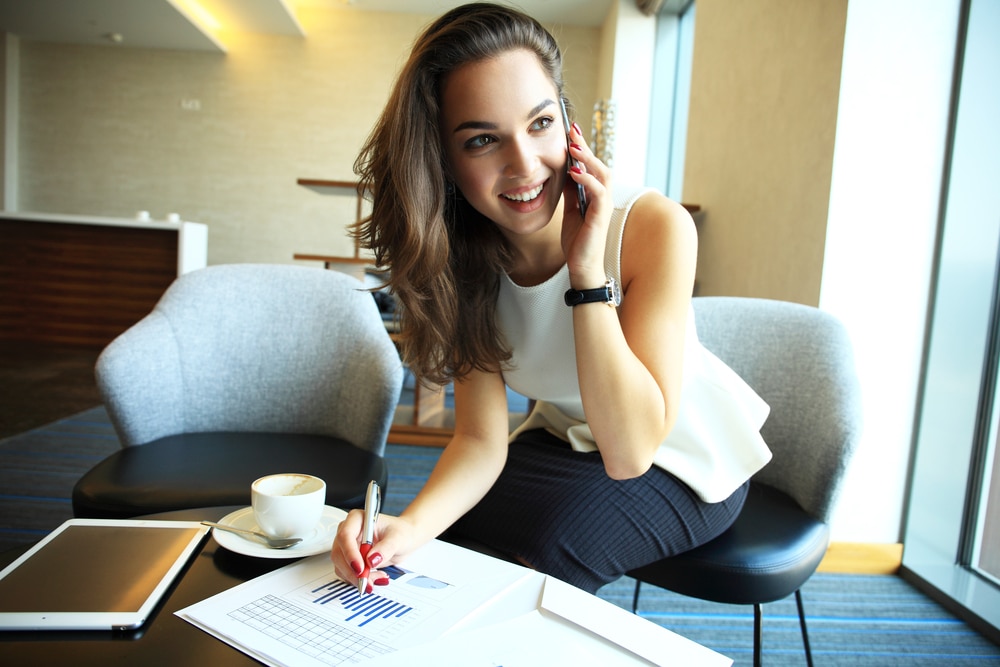 Woman using her phone for online dating purposes