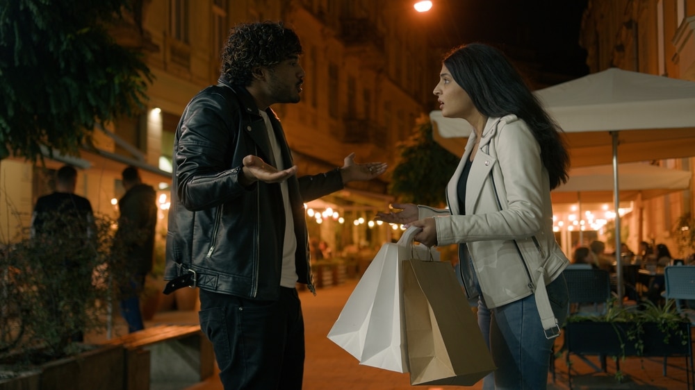 Man and woman arguing on the street.